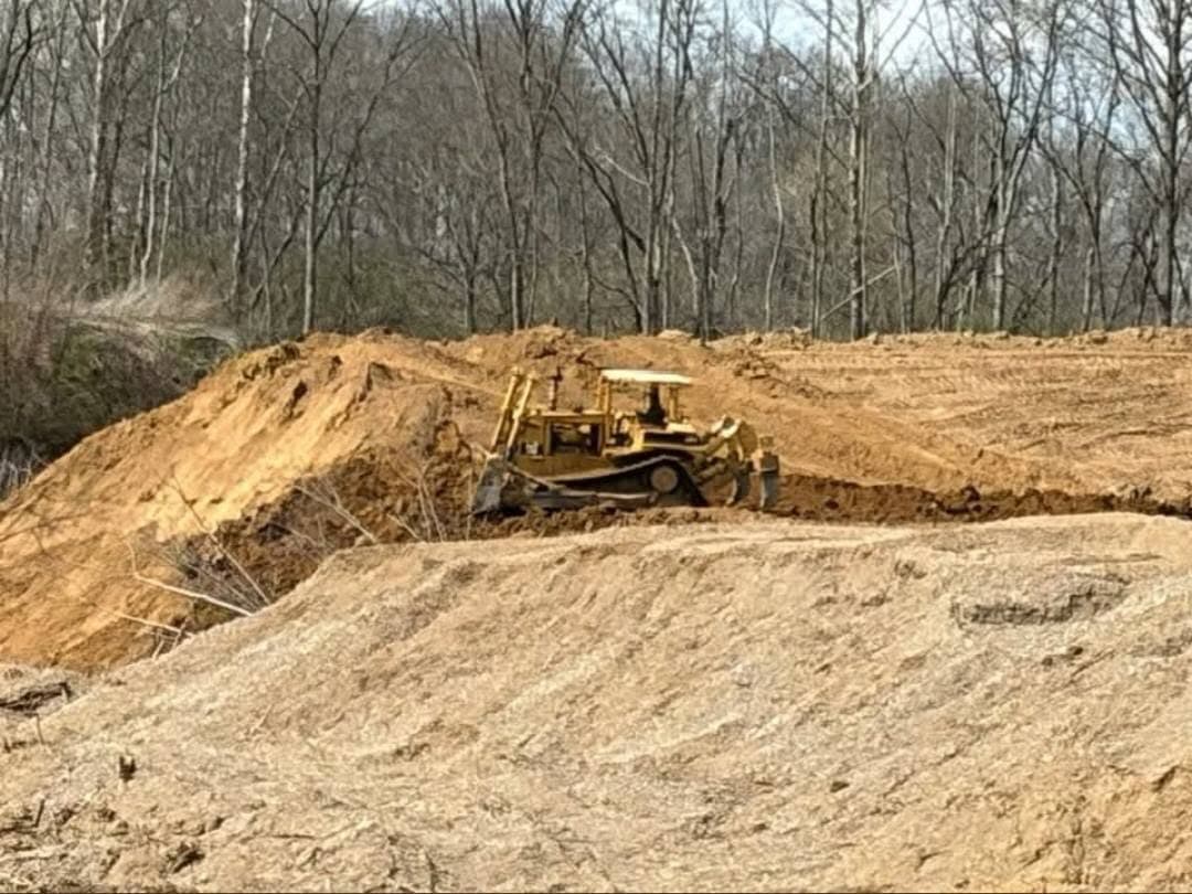 Dozer working a material stockpile